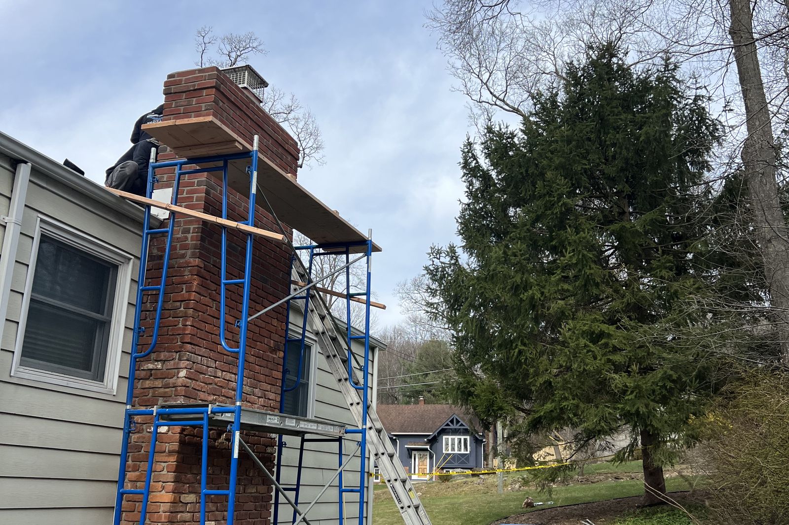 Scaffolding set up around a brick chimney during a rebuild in New Jersey