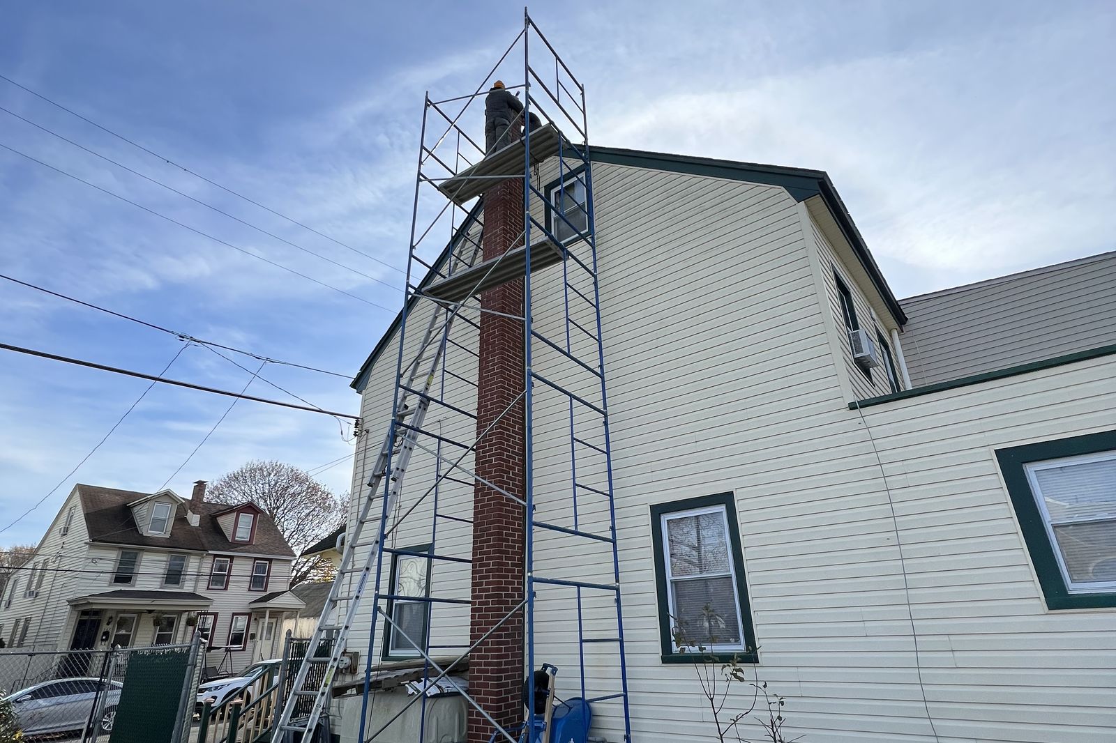 Tall scaffolding set up for a chimney rebuild project on a New Jersey home