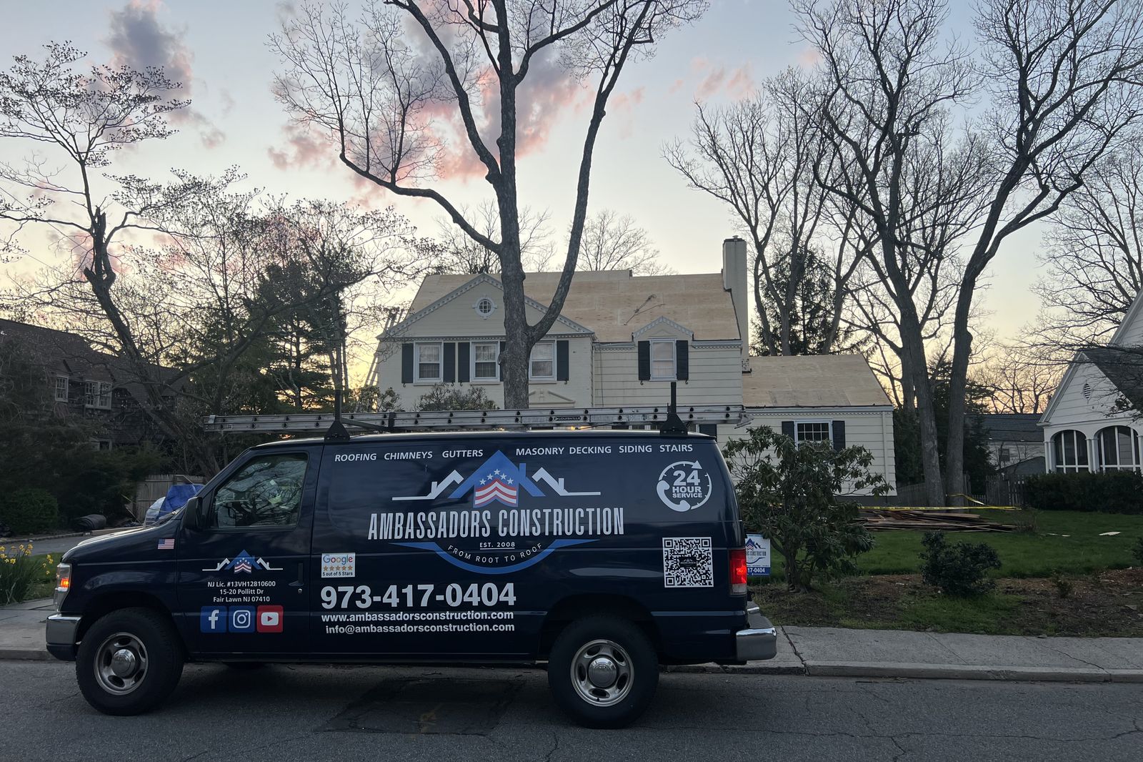 Ambassadors Construction service van parked outside a New Jersey home during an emergency roofing job