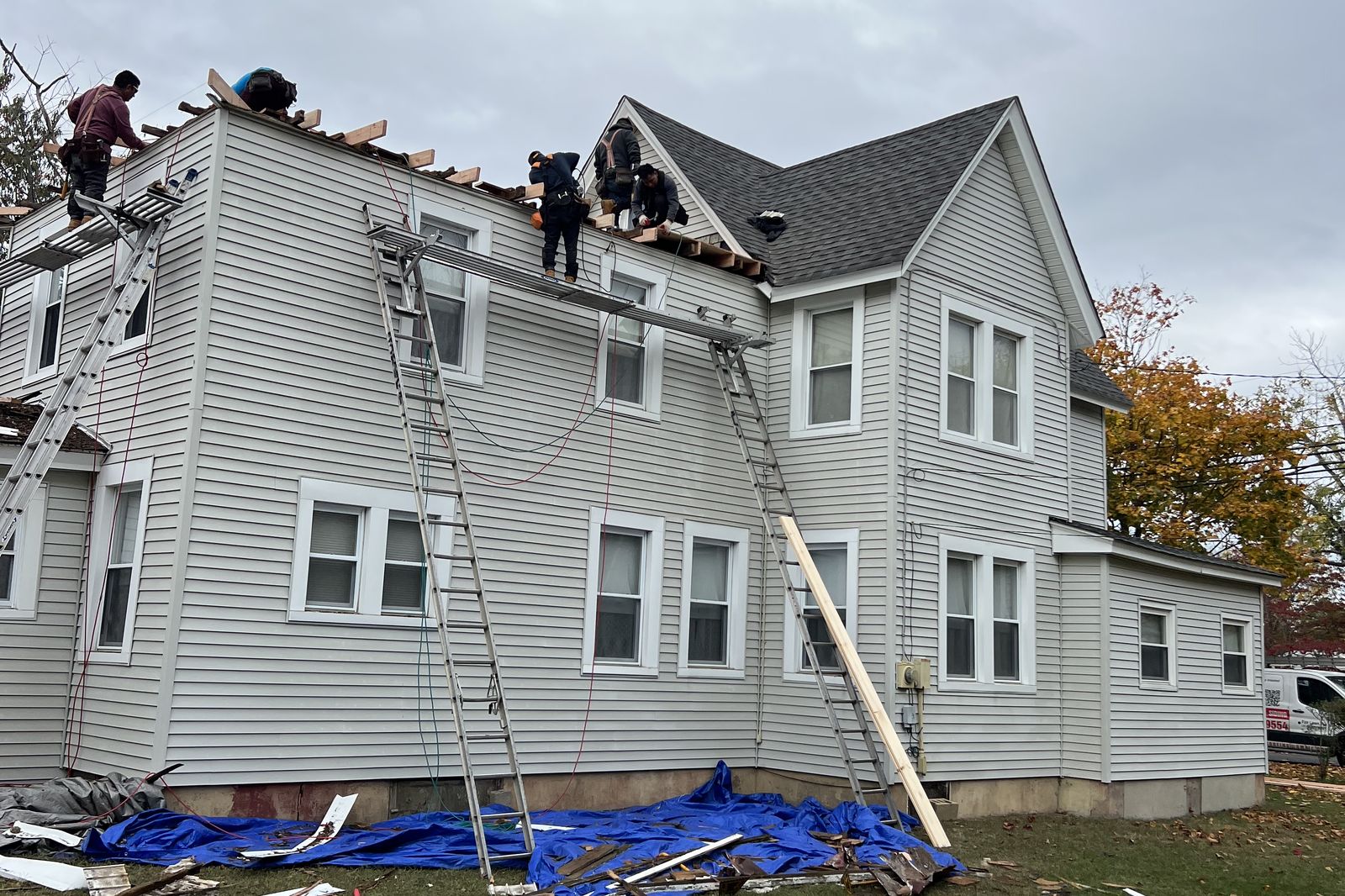 Ambassadors Construction crew performing a full roof replacement on a large New Jersey home