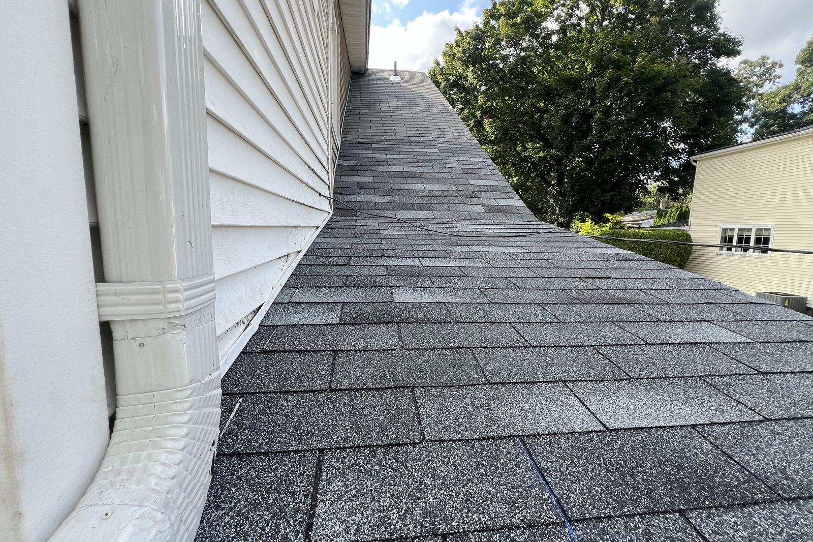 Close-up of a newly installed asphalt shingle roof valley in New Jersey