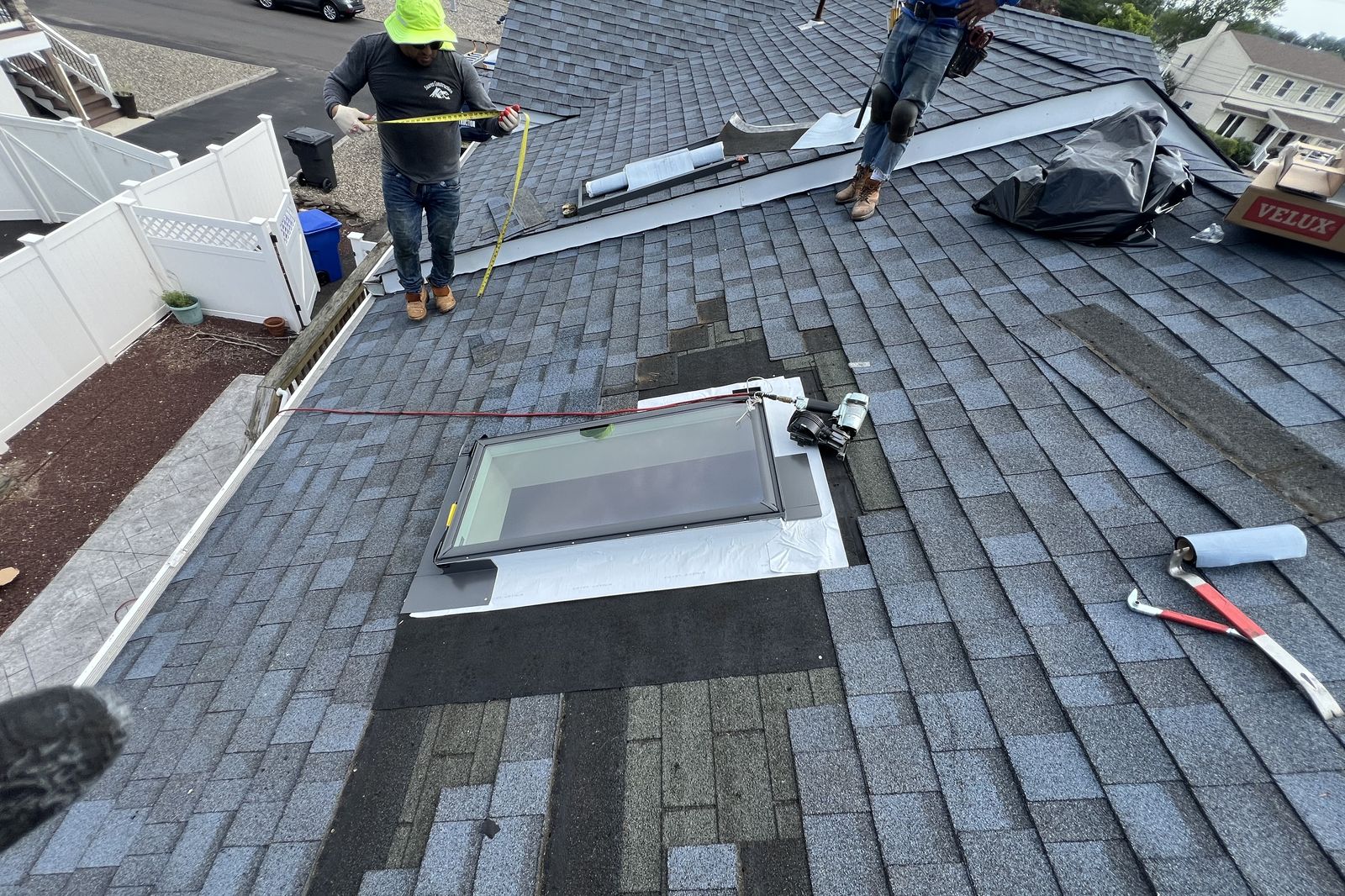 Ambassadors Construction crew installing a new Velux skylight on a New Jersey home