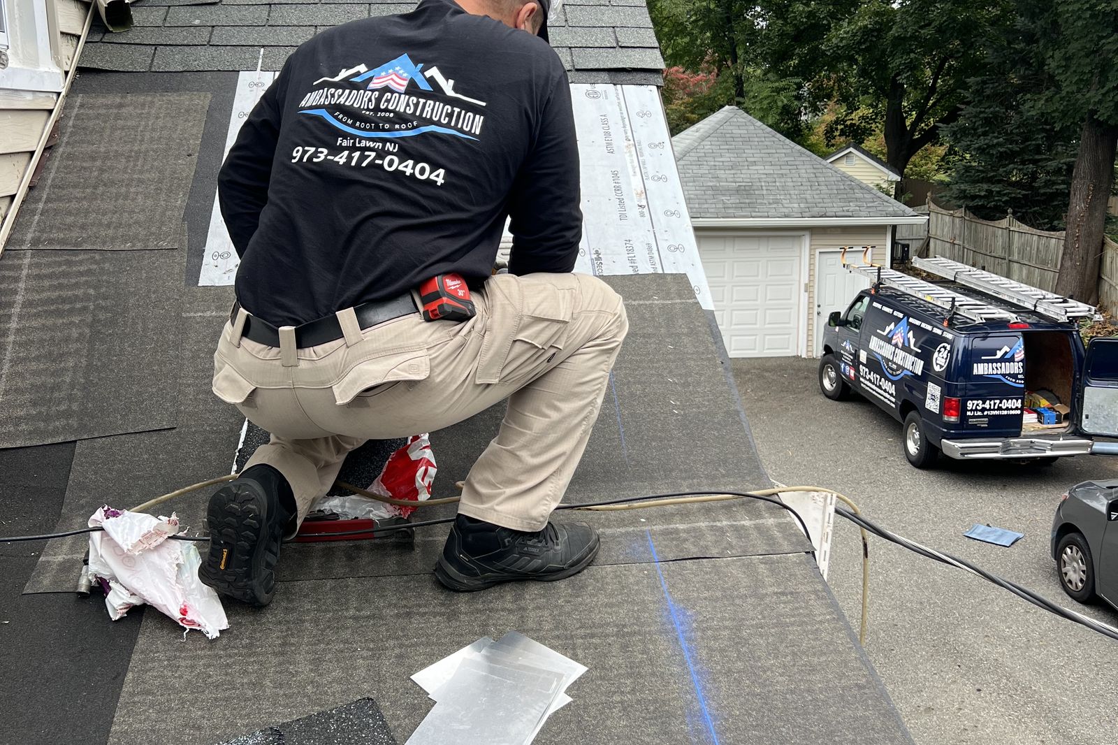 Ambassadors Construction roofer installing flashing during a roof repair in New Jersey
