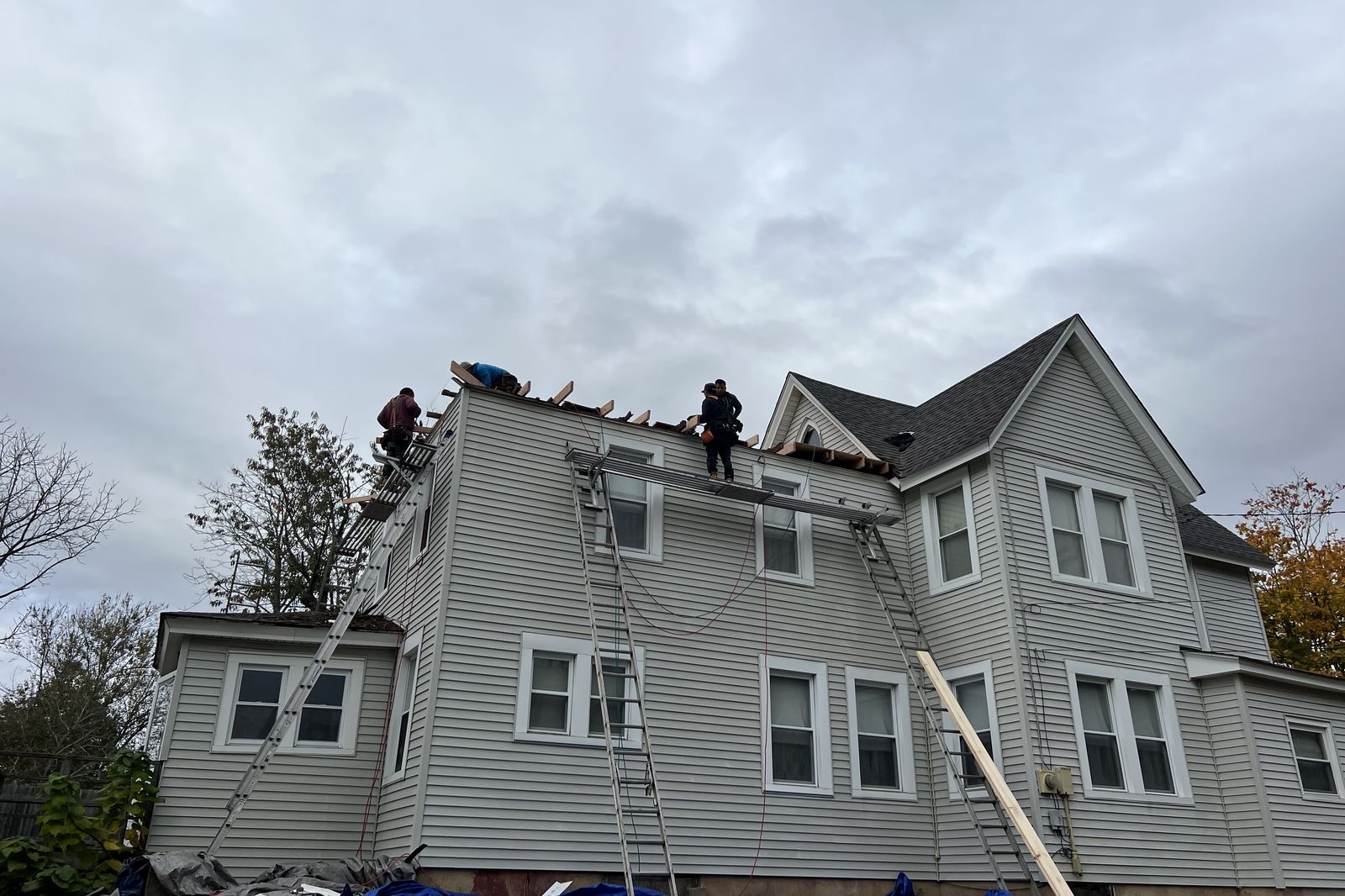 Ambassadors Construction roofing crew working on a roof replacement in New Jersey