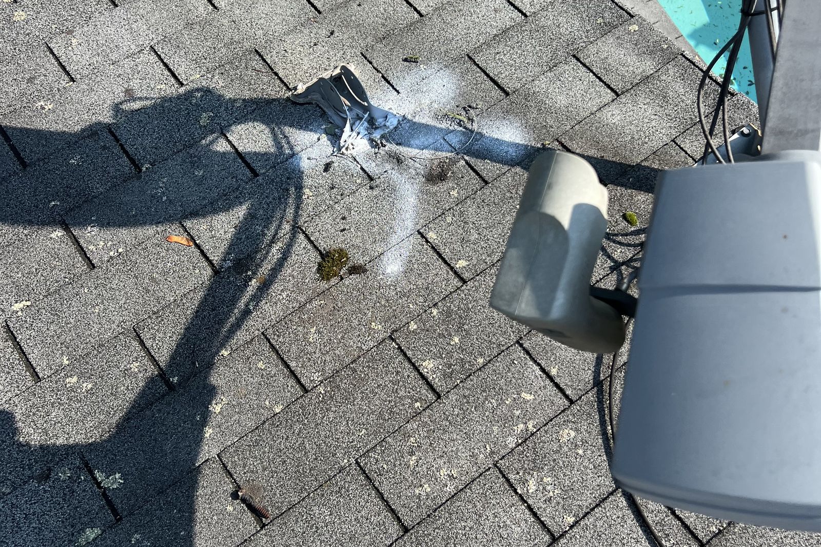 Close-up of roof vent flashing and attic ventilation components on a New Jersey home