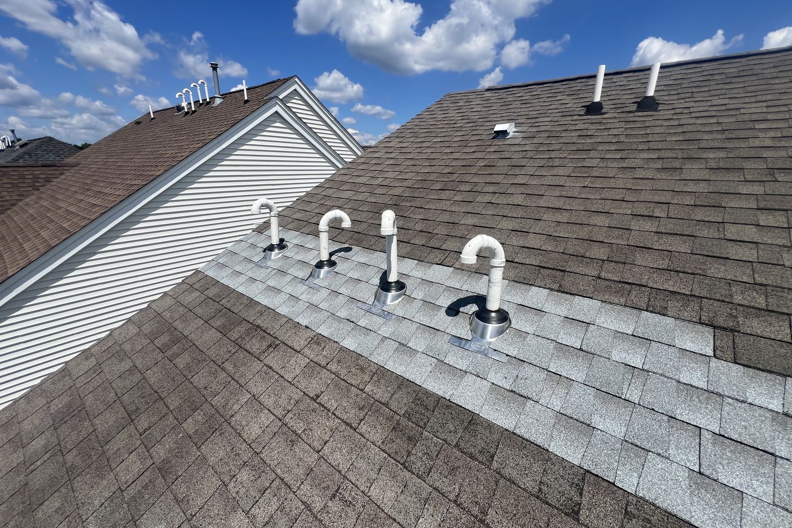 Newly installed roof vent pipes for attic ventilation on a New Jersey home