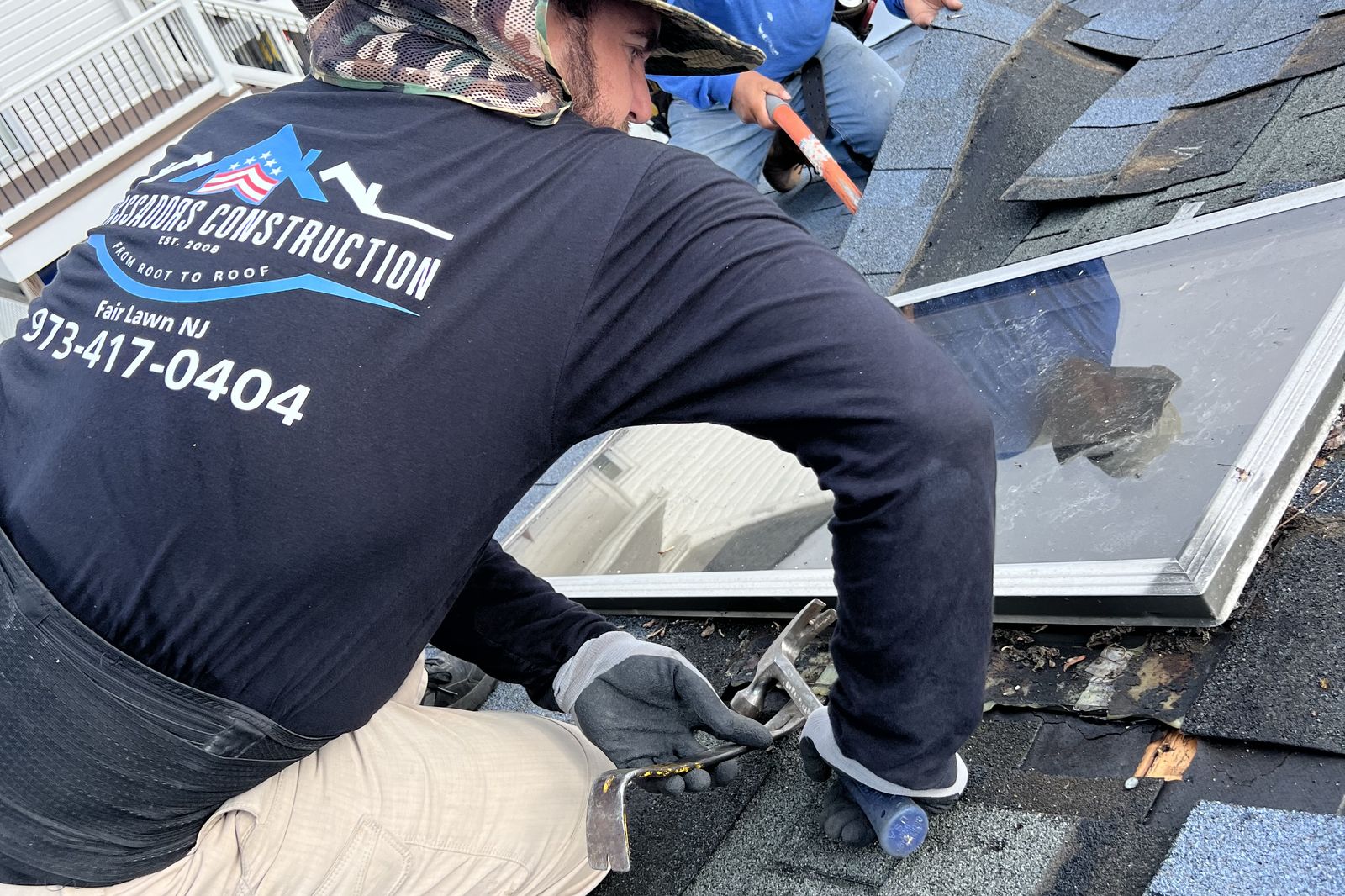 Ambassadors Construction crew removing an old skylight from a New Jersey roof