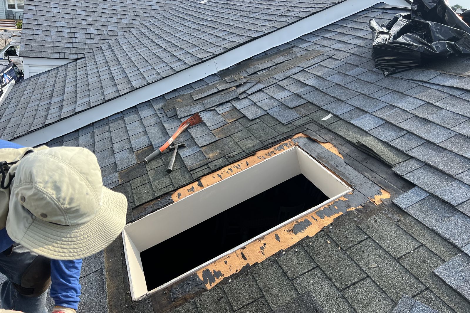 Close-up of roof decking repair around a skylight opening in New Jersey