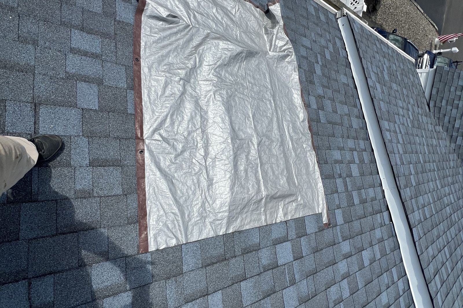 Tarped roof opening protecting a home during a skylight replacement in New Jersey