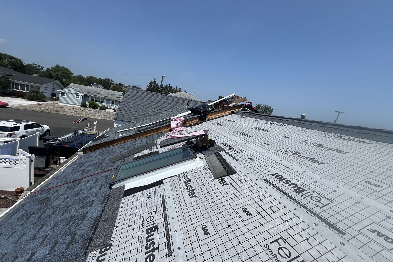 New synthetic roofing underlayment installed around a skylight during a New Jersey roof project